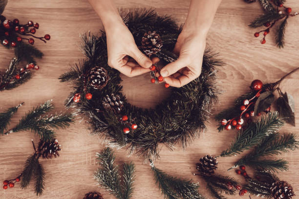 istock Woman Making Christmas Wreath for Xmas Holidays. 1061845268