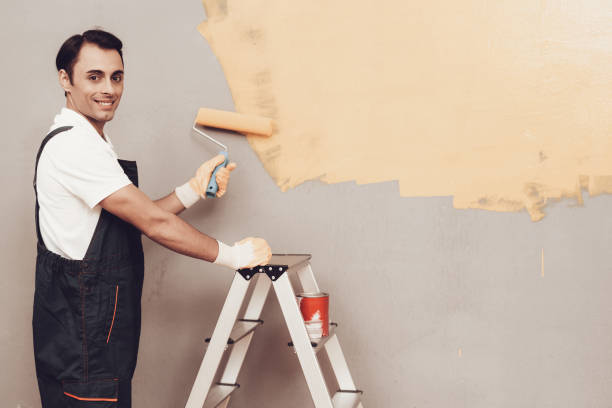 istock Smiling Arab Master with Paint and Brush in Hand. 1061845404