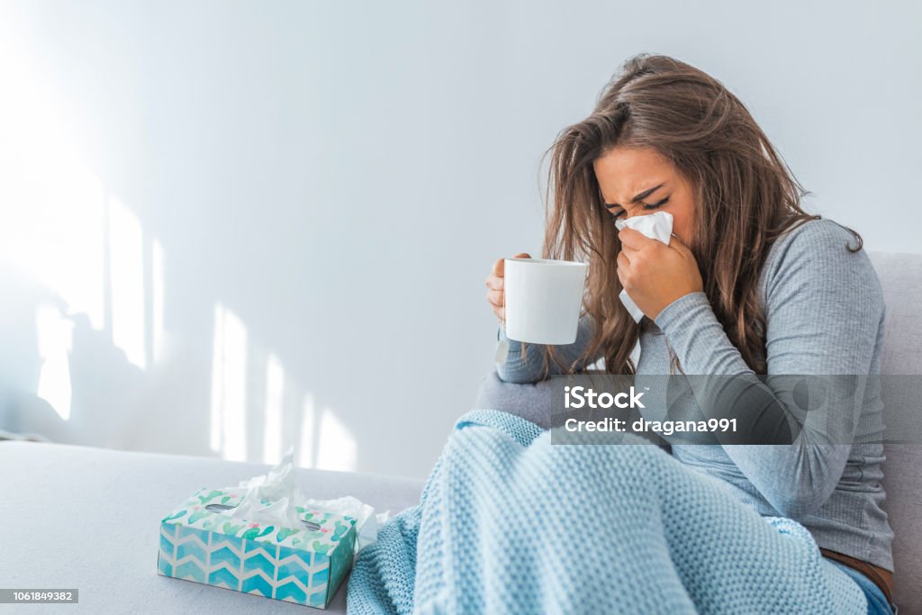 Portrait Of Ill Woman Caught Cold Cold And Flu. Portrait Of Ill Woman Caught Cold, Feeling Sick And Sneezing In Paper Wipe. Closeup Of Beautiful Unhealthy Girl Covered In Blanket Wiping Nose. Healthcare Concept. High Resolution Cold And Flu Stock Photo
