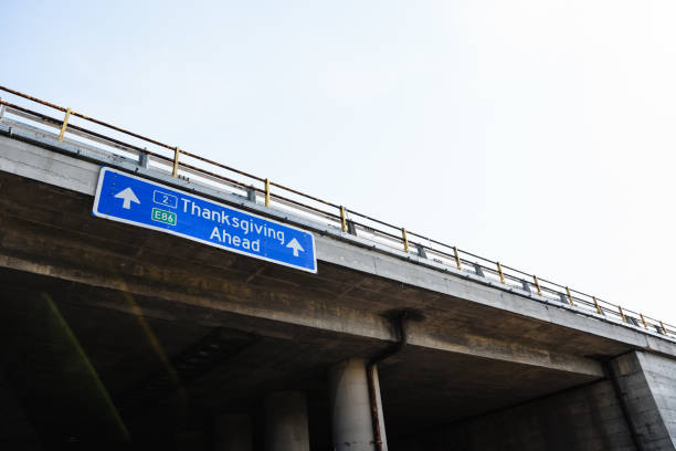 Thanksgiving Ahead Blue Road Sign Against Clear Sky