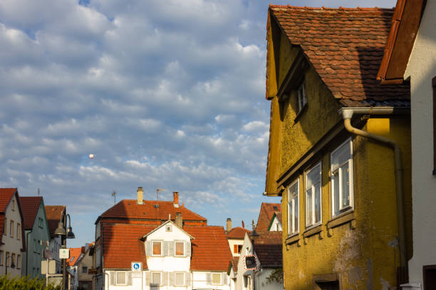 istock rooftops with antenna of old buildings 1061852838