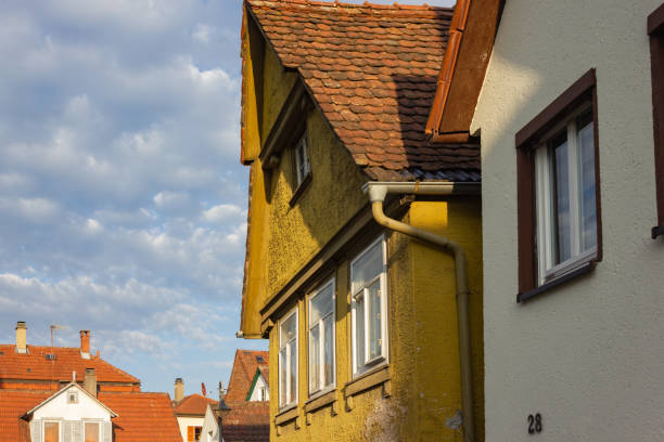 istock rooftops with antenna of old buildings 1061852896