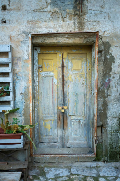 istock Vintage door with cracked paint 1061856052