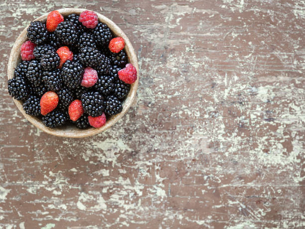 istock Small clay bowl of freshly assorted berries 1061856166