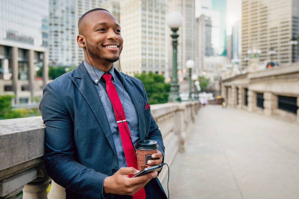Chicago Businessman with Headset using his Mobile Phone
