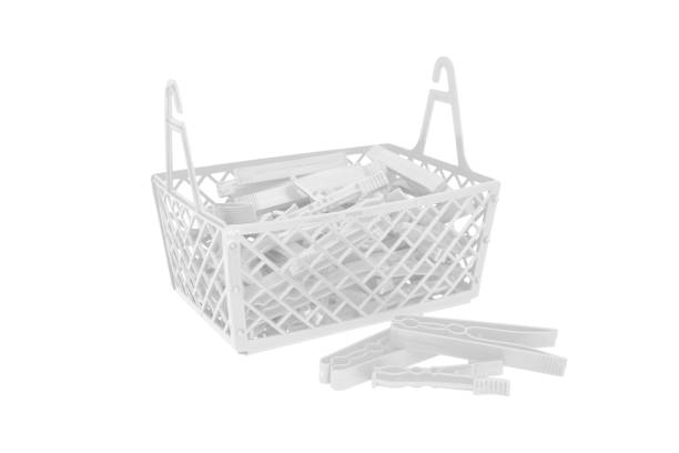 istock Pile of color plastic cloth clamps inside basket isolated on white 1061859532