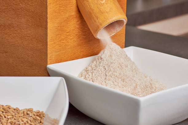 flour mill with fresh spelt flour freshly ground spelt grains in a domestic flour mill flour mill stock pictures, royalty-free photos & images