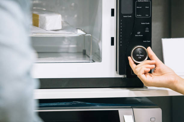 istock Looking at the features of a microwave oven 1061866388