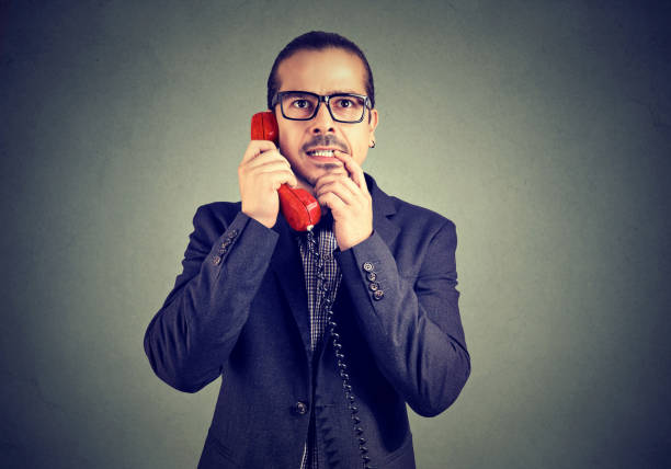 istock Confused man speaking on a phone 1061866506