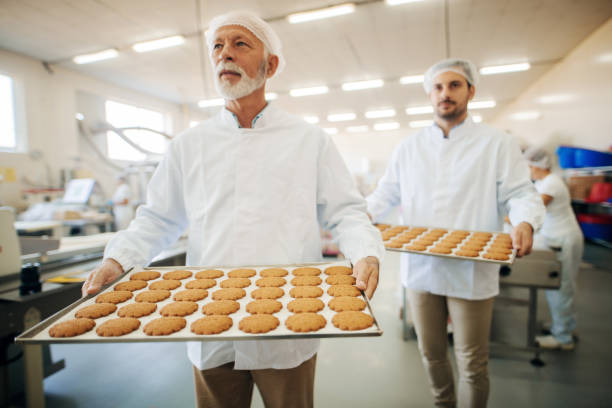 istock Two men carrying cookies. 1061869550