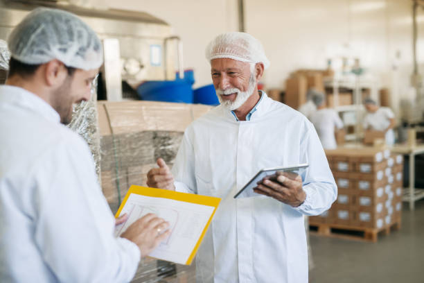 istock Supervisors talking about food quality. In hands chart and tablet. 1061871570