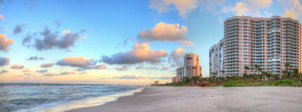 istock Sunrise over the white sand of Vanderbilt Beach 1061871712