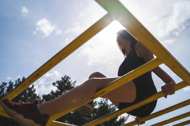 istock Woman exercising in a public park 1061874002