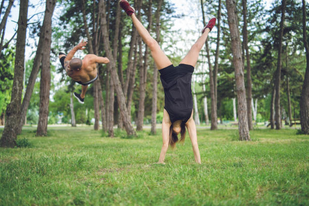 istock Young couple training in public park 1061875332