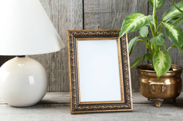 istock Empty brass picture frame on wooden background. 1061877780