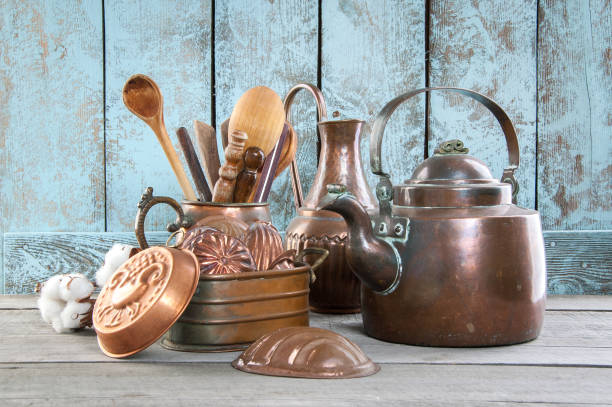 Interior of an old traditional kitchen. Clay and copper utensils on the kitchen shelf. Home decor in traditional rustic Provence style