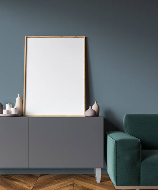 istock Vertical poster on gray cabinet, armchair 1061880238