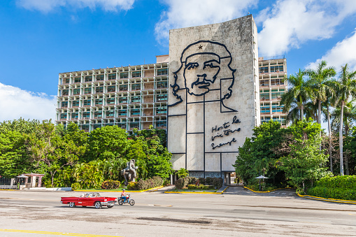 Havana, Cuba – March 13, 2013: Giant image of Cuban revolutionary leader Che Guevara, with one of his slogans, displayed on the side of a building in Plaza de la Revolucion, Havana