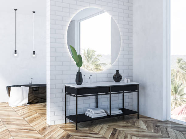 istock White brick bathroom corner, black tub 1061883244