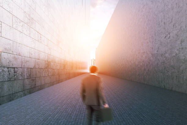 istock Businessman looking narrow passage between houses 1061883436