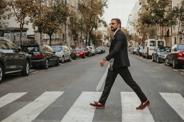 istock Macho businessman crossing the street 1061888992