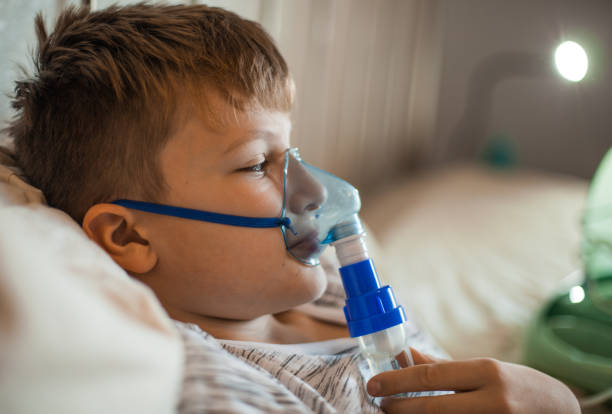 istock Boy Doing Inhalation Therapy at Home 1061889814