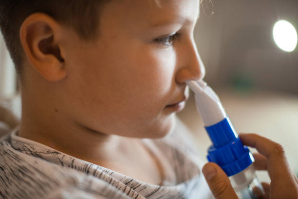 istock Boy Doing Inhalation Therapy at Home 1061889834