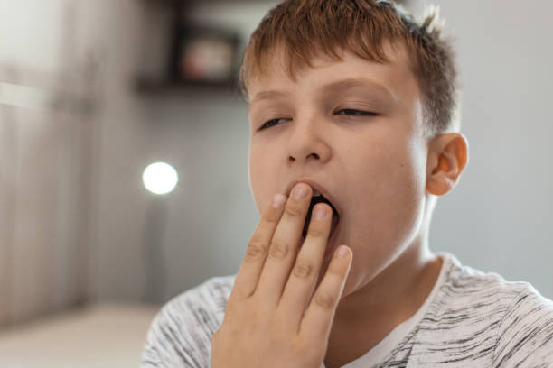 istock Boy With a Big Yawn 1061890010