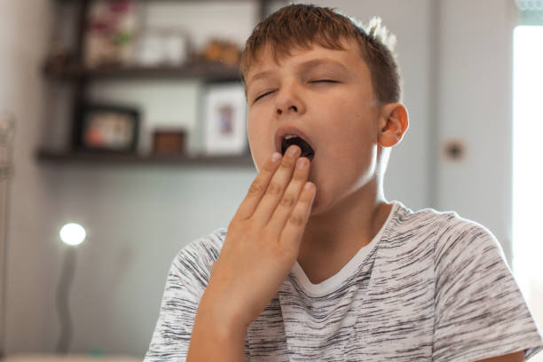 istock Boy With a Big Yawn 1061890020