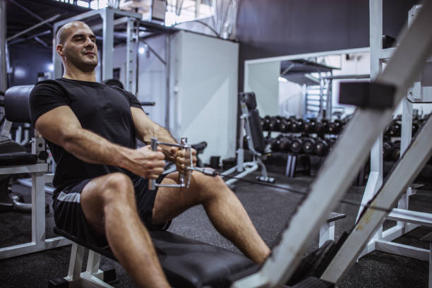 istock Muscular Fit Man Exercising in a Gym 1061892868