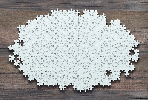 Blank jigsaw puzzle missing pieces to finish. Concept of work not completed.