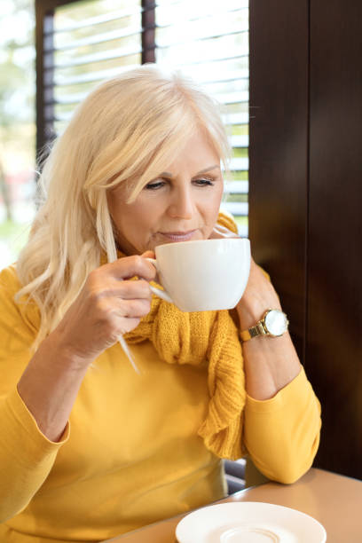 istock Beautiful senior woman drinking cofee. 1061899826