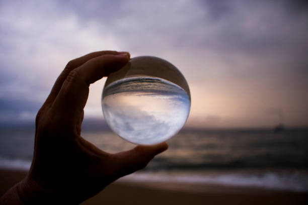 istock Dramatic Sunset Clouds in Seascape as Storm Approaches Captured in Glass Ball 1061900546