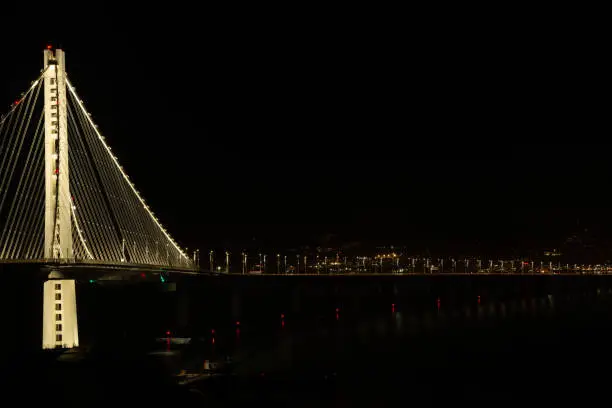 Bridge and city at night lit up