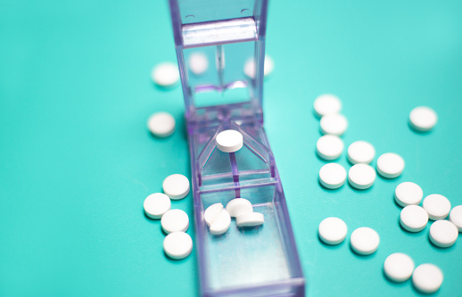 Pill Splitter, Pills, Turquoise Background