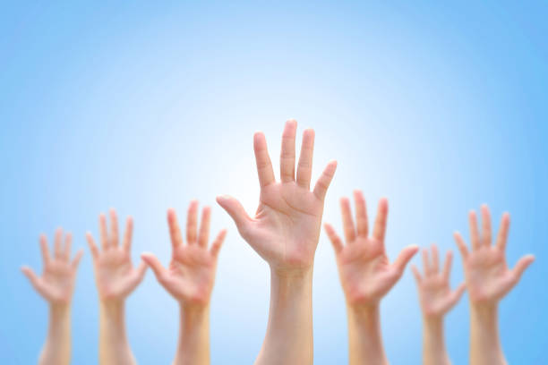 many people women hands raising up on world map background showing vote, volunteer participation, rights equality concept - crowd community large group of people protest imagens e fotografias de stock