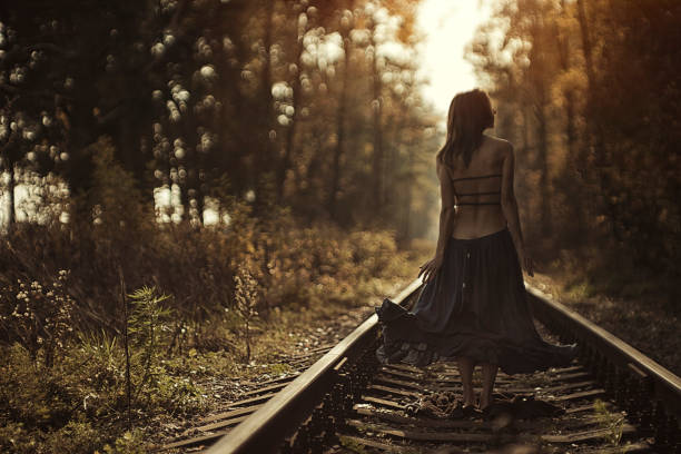 istock Woman walking on rails 1061916262