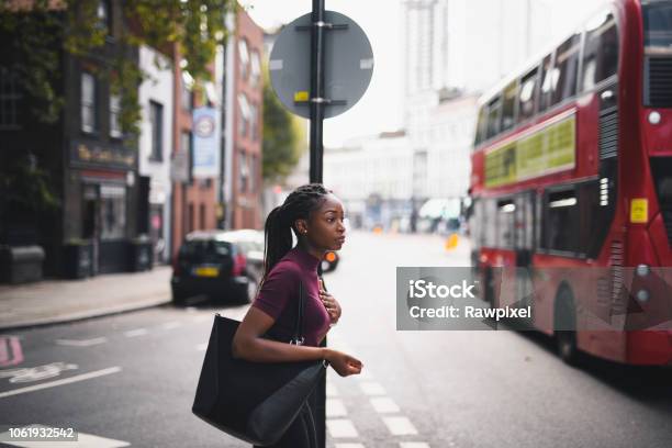 Woman With Braids Crossing A Street In Downtown London Stock Photo - Download Image Now