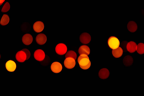 istock The colorful bokeh on the blurred natural black background. 1061934270