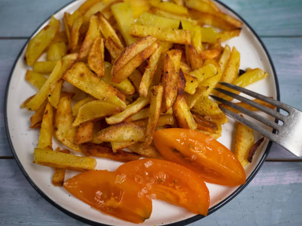 istock breakfast of fried potatoes with fresh popidoms 1061940080