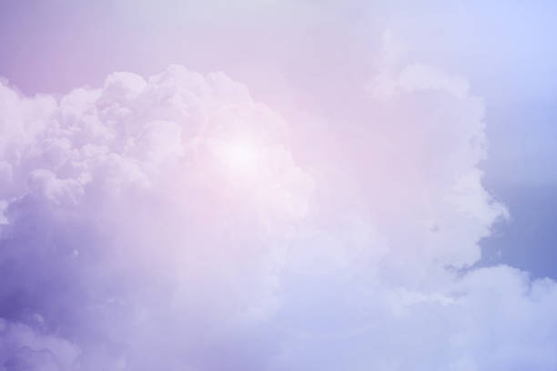 istock fantasy cloudy sky with pastel gradient color and lens flare, nature abstract background 1061941950