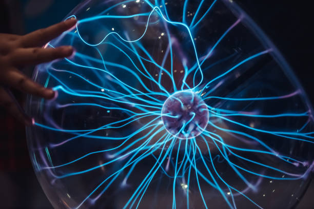 istock Close up of Plasma globe and child's hand 1061946704