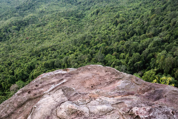 istock rough and rock mountain pick and forest underneath 1061946780