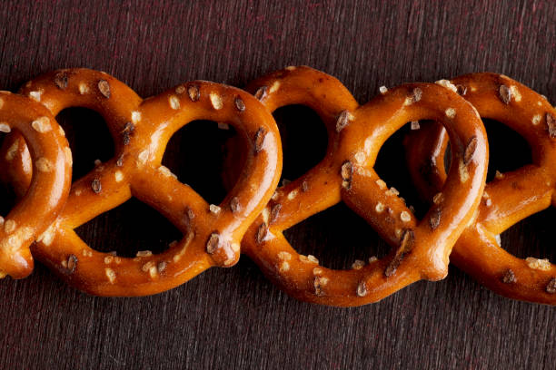 istock Pretzels on Dark Red Black Background 1061948236