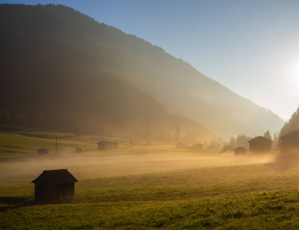 istock Fall sunrise on the alps with moisture in the air 1061966028