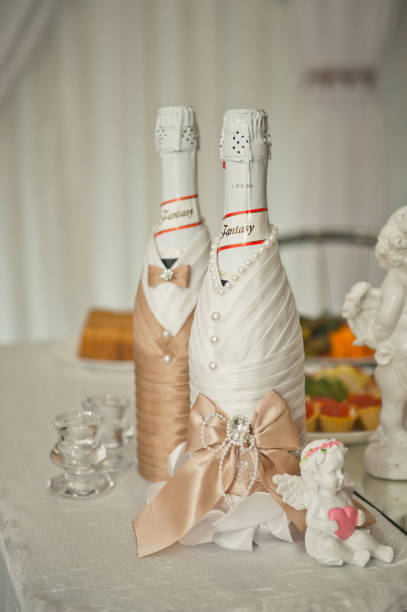 istock Champagne dressed as bride and groom 1606. 1061971490