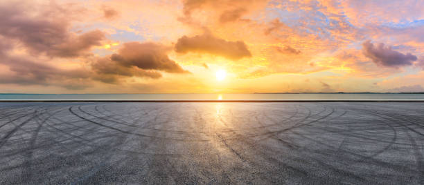 istock Circuit road and dramatic sky with coastline panorama at sunset 1061975580