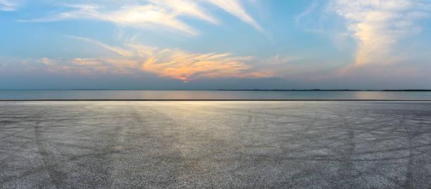 istock Circuit road and dramatic sky with coastline panorama at sunset 1061976852