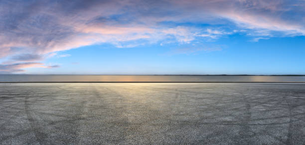istock Circuit road and dramatic sky with coastline panorama at sunset 1061976872