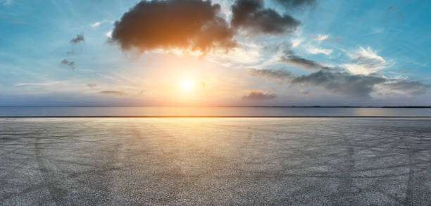 istock Circuit road and dramatic sky with coastline panorama at sunset 1061976876